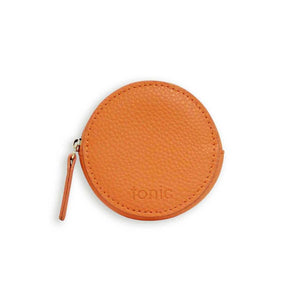 Orange coin purse. Shop gifts at paper twist in charlotte